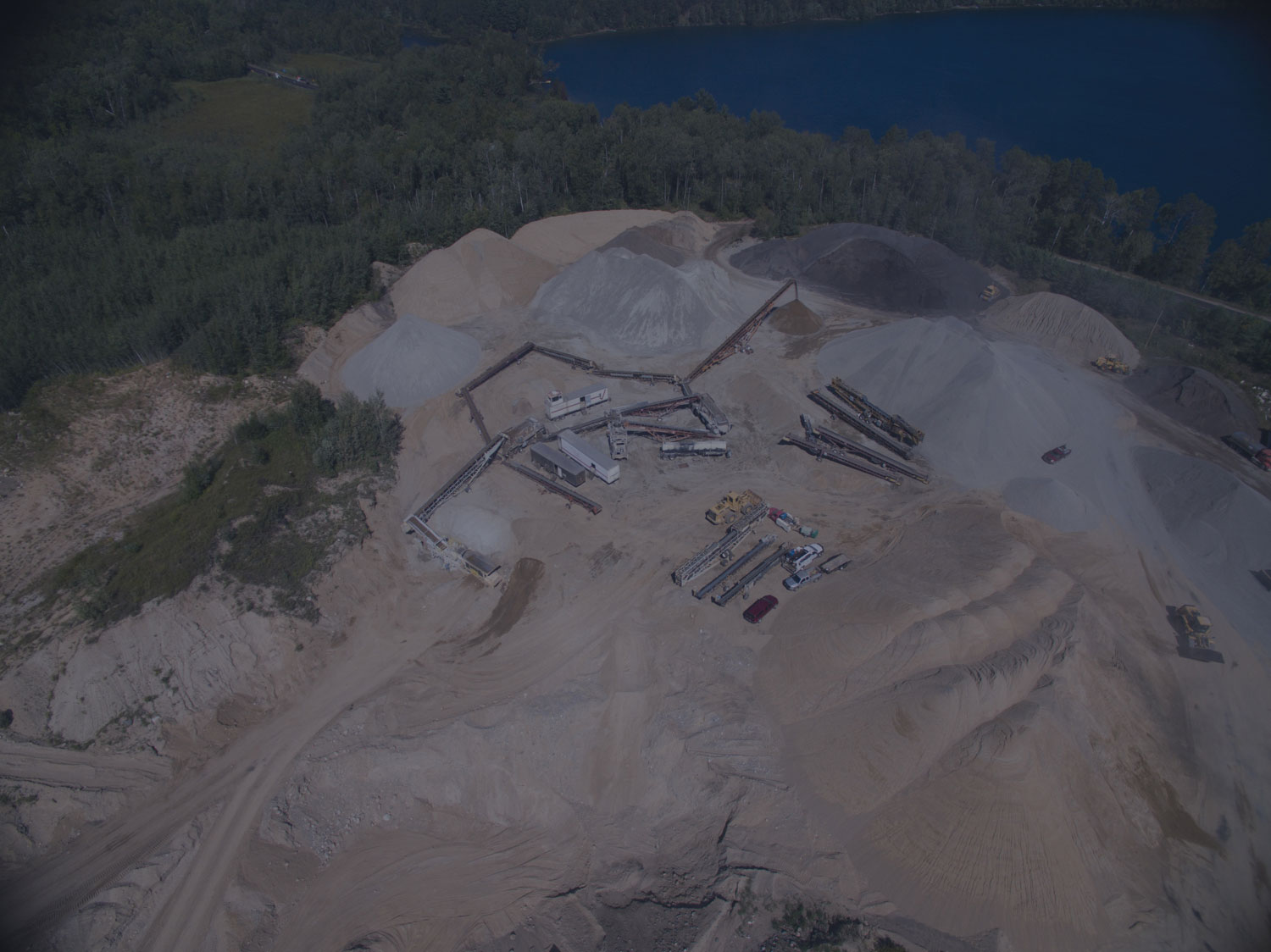 Birds-eye view of quarry full of sand, rocks and various aggregate